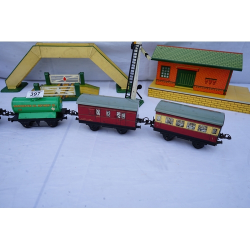 397 - Hornby: A collection of O Gauge Trains and Scenery Items . Each Piece is Individually Boxed in its o... 