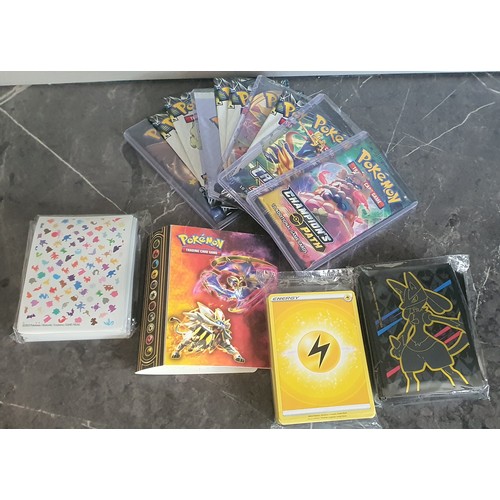 20 - 10x Sealed packs of Pokemon Trading Cards plus small album containing foil cards and other Pokemon T... 