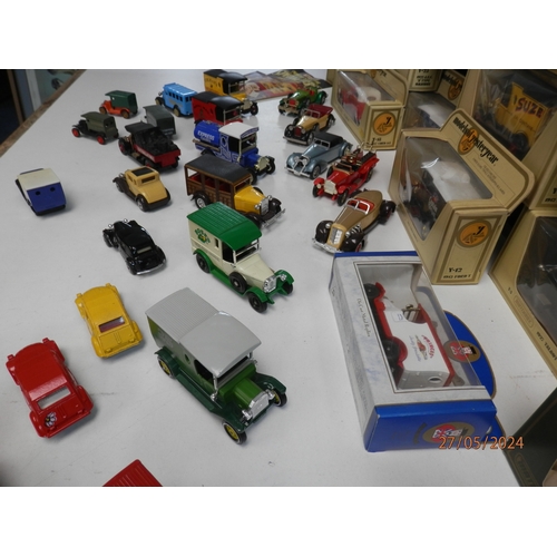 668 - Good Collection of Boxed Diecast Cars and Vehicles