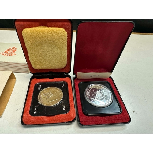 687 - 1977 Canadian Dollar Silver Proof Coin and a Canadian Centenary Silver Dollar both Cased