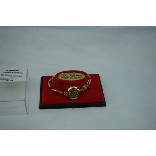 33 - Unused Gold Plated SOS Talisman