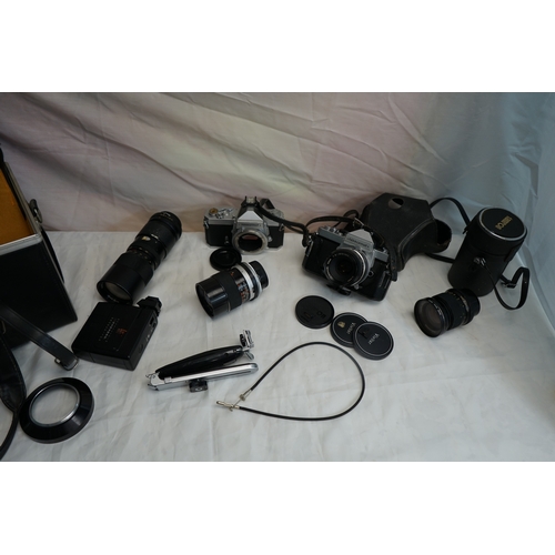 48 - Two Nikon Nikkormat FT2 35mm SLR Cameras with Assorted Lens's & Accessories in Leather Carry Case