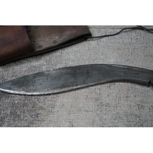 184 - A World War II Kukri knife the blade stamped Pioneer Calcutta 1942, with Scabbard and Holster Stampe... 