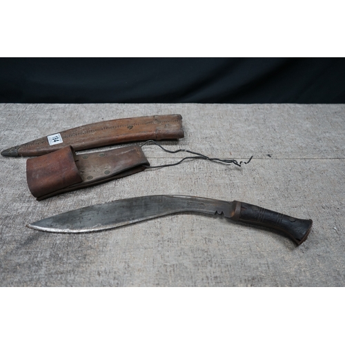 184 - A World War II Kukri knife the blade stamped Pioneer Calcutta 1942, with Scabbard and Holster Stampe... 