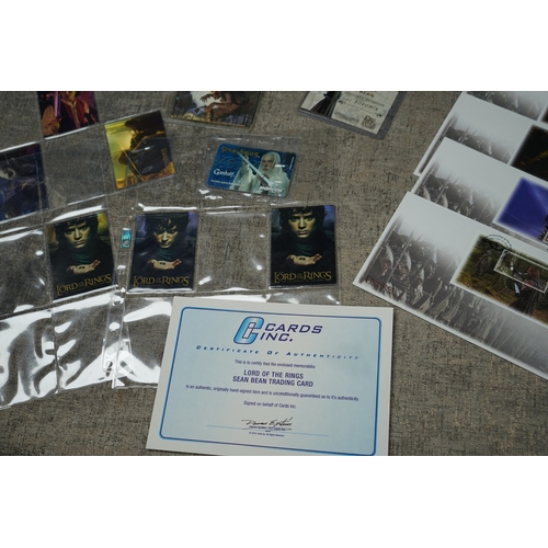 195 - Collection of Lord of the Rings memorabilia, including trading cards, a Sean Bean signed card, first... 