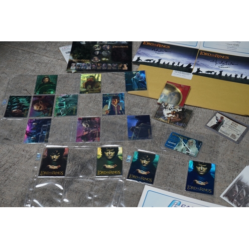 195 - Collection of Lord of the Rings memorabilia, including trading cards, a Sean Bean signed card, first... 