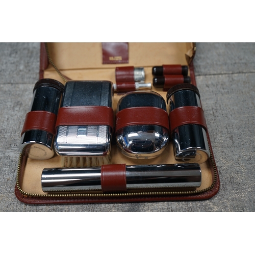 196 - Vintage gents grooming set with original leather case, includes mirror, razor, and blade holders, ma... 