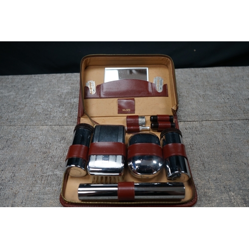 196 - Vintage gents grooming set with original leather case, includes mirror, razor, and blade holders, ma... 