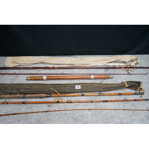 204 - Collection of vintage bamboo fishing rods with protective cases.