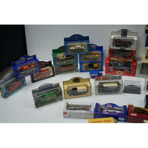 102 - Collection of boxed die-cast model vehicles including Dinky Toys, Corgi, and Days Gone models.