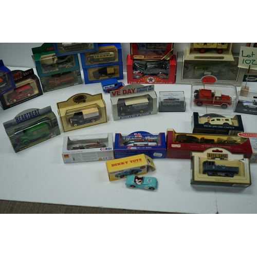 102 - Collection of boxed die-cast model vehicles including Dinky Toys, Corgi, and Days Gone models.