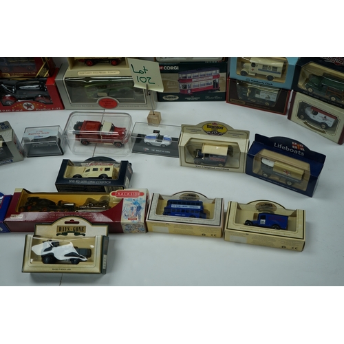 102 - Collection of boxed die-cast model vehicles including Dinky Toys, Corgi, and Days Gone models.