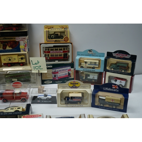 102 - Collection of boxed die-cast model vehicles including Dinky Toys, Corgi, and Days Gone models.