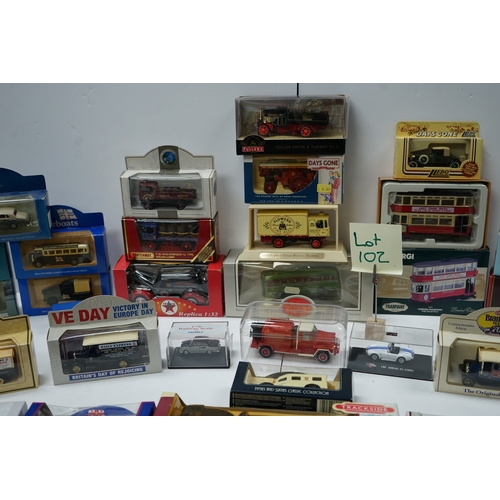 102 - Collection of boxed die-cast model vehicles including Dinky Toys, Corgi, and Days Gone models.