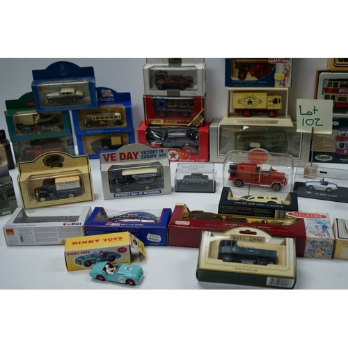 102 - Collection of boxed die-cast model vehicles including Dinky Toys, Corgi, and Days Gone models.