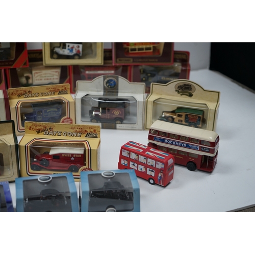 103 - Collection of die-cast model vehicles including various buses, trucks, and emergency vehicles, mostl... 