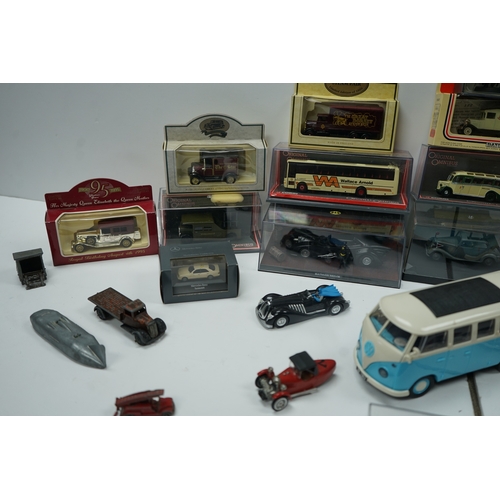 107 - Collection of model vehicles and figurines including buses, cars, motorcycles, and a Batman figure.