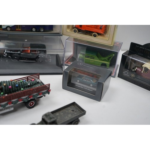 107 - Collection of model vehicles and figurines including buses, cars, motorcycles, and a Batman figure.