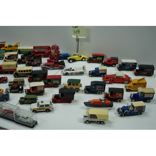 109 - Collection of toy model vehicles including various cars, buses, and trucks, some in original packagi... 