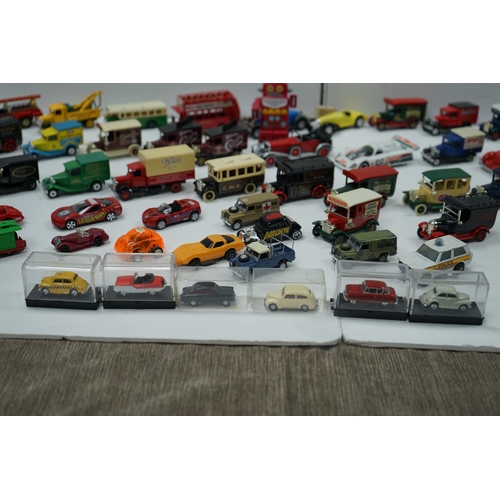 109 - Collection of toy model vehicles including various cars, buses, and trucks, some in original packagi... 