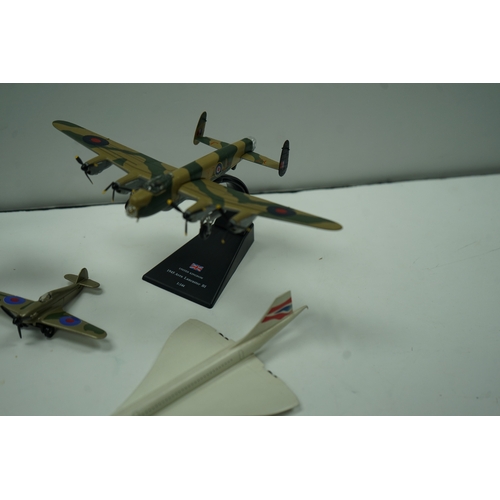 117 - Collection of model airplanes, including various biplanes, a Concorde model, and military aircraft.