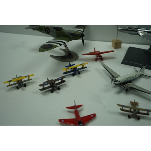 117 - Collection of model airplanes, including various biplanes, a Concorde model, and military aircraft.