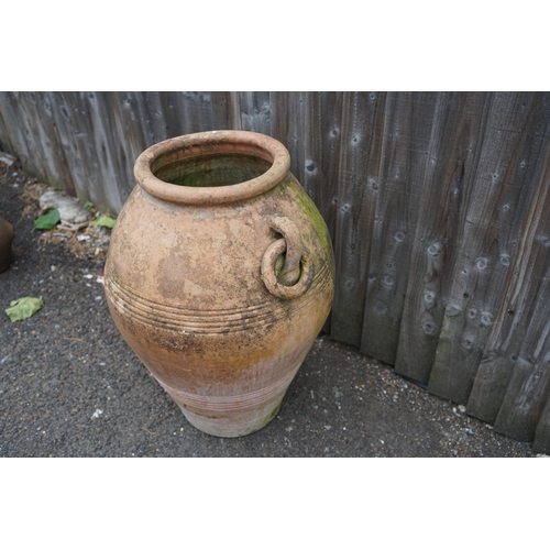 1179 - Gardens, Pots & Planters:  A Large clay amphora form plant pot 60cm T x 46cm Dia.