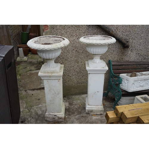 1183 - Gardens, Pots & Planters: A Pair of Victorian Style urns on pedestals.  (128cm T x 54cm Dia.)