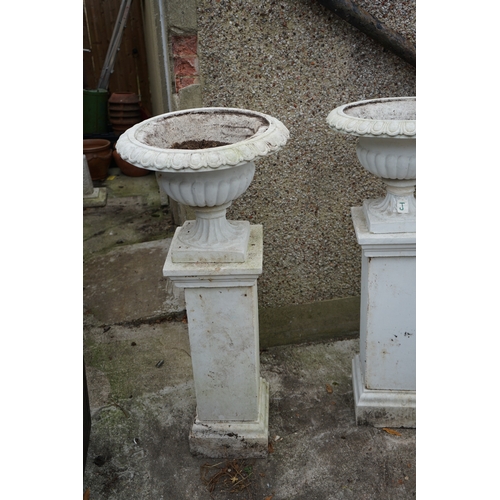 1183 - Gardens, Pots & Planters: A Pair of Victorian Style urns on pedestals.  (128cm T x 54cm Dia.)