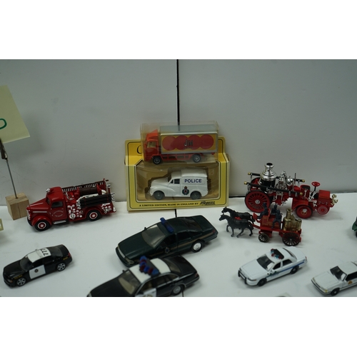 120 - Collection of die-cast model vehicles including police cars, fire trucks, and vintage delivery truck... 