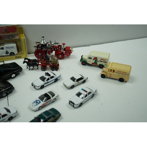 120 - Collection of die-cast model vehicles including police cars, fire trucks, and vintage delivery truck... 