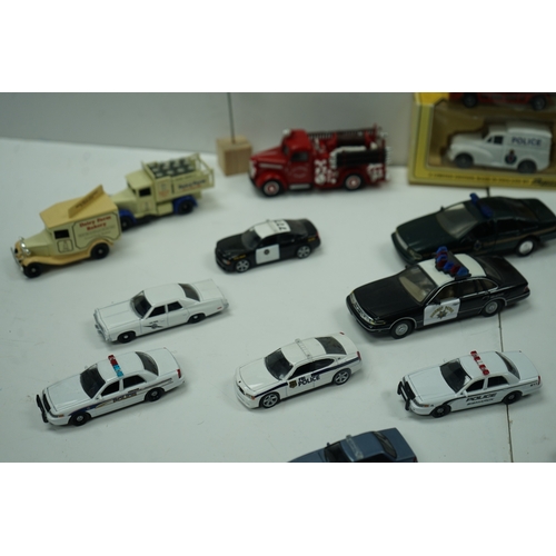 120 - Collection of die-cast model vehicles including police cars, fire trucks, and vintage delivery truck... 