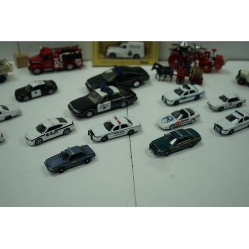 120 - Collection of die-cast model vehicles including police cars, fire trucks, and vintage delivery truck... 