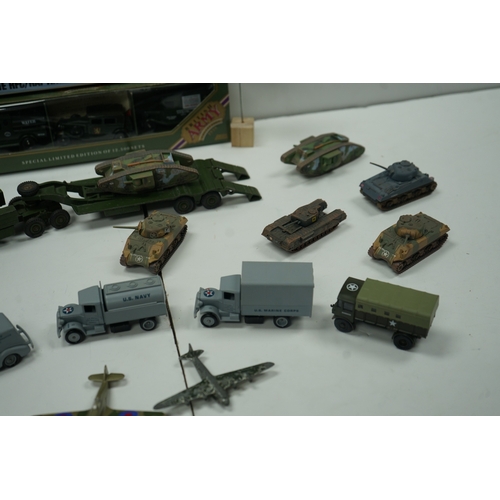 121 - Collection of military vehicle and aircraft models, including tanks, trucks, and planes. Also includ... 