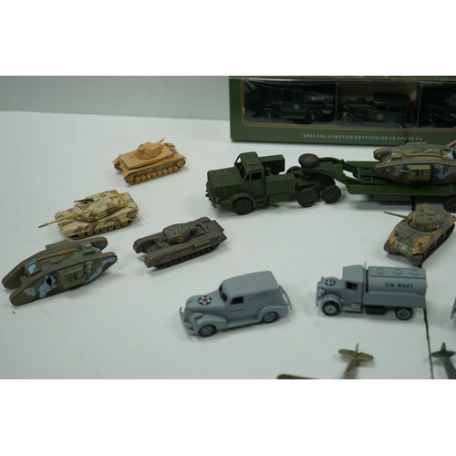 121 - Collection of military vehicle and aircraft models, including tanks, trucks, and planes. Also includ... 