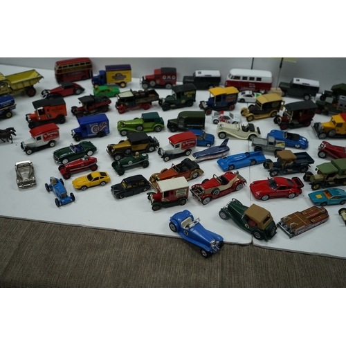 122 - Collection of miniature vehicles including cars, trucks, buses, and vans.