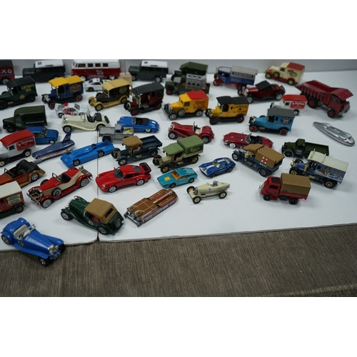 122 - Collection of miniature vehicles including cars, trucks, buses, and vans.