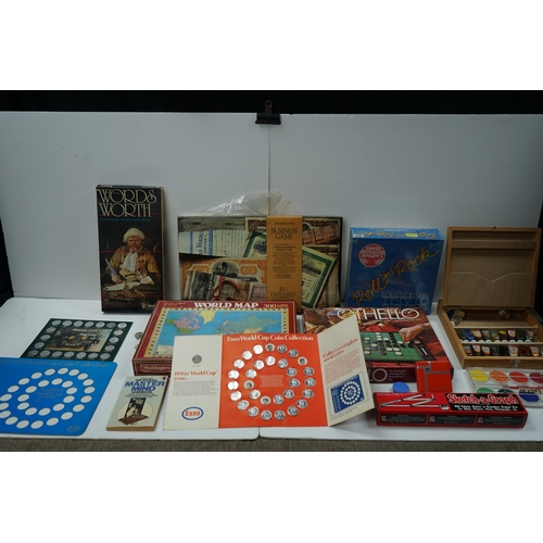 422 - Collection of vintage board games and coin collections including Wordsworth, World Map Puzzle, Othel... 