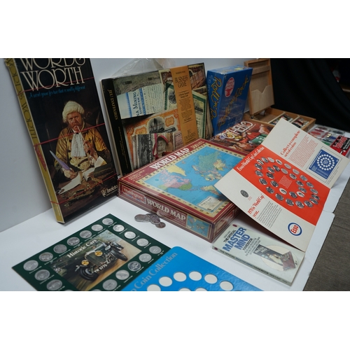 422 - Collection of vintage board games and coin collections including Wordsworth, World Map Puzzle, Othel... 