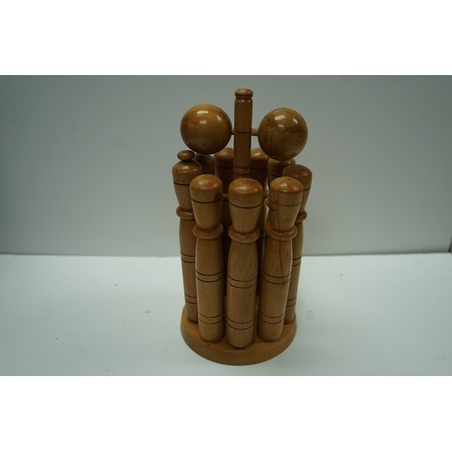 431 - Wooden lawn bowling set with pins and balls on a stand.