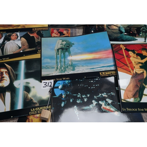 312 - Collection of movie and TV show memorabilia including Star Wars figures, Indiana Jones poster, Buffy... 