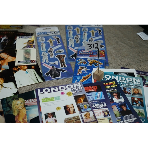 312 - Collection of movie and TV show memorabilia including Star Wars figures, Indiana Jones poster, Buffy... 