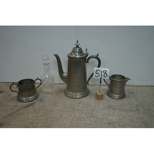 518 - A Pewter Coffee Pot, Milk Jug and Sugar Bowl plus a Cut Glass Bottle