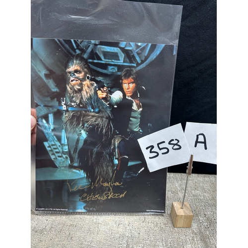 358a - Star Wars Interest: A Peter Mayhew autographed Photograph of Chewbacca & Han Solo