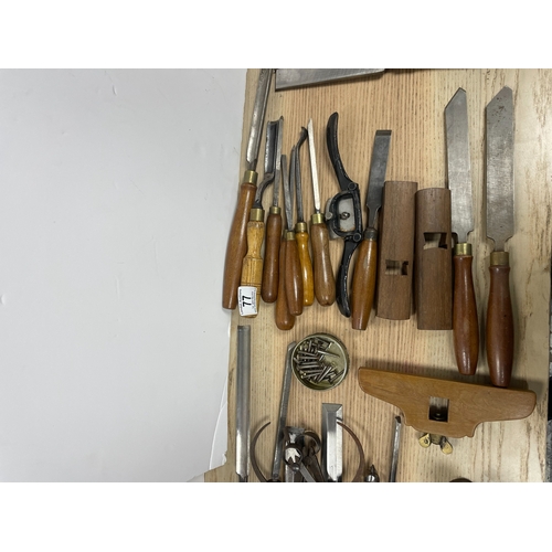 Collection of vintage woodworking tools, including various chisels ...