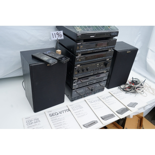 1196 - Collection of Sony stereo components, including two speakers, a turntable, multiple audio units, rem... 