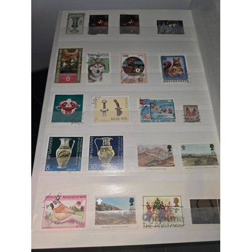 99A - 3x good albums of world stamps - small page example shown