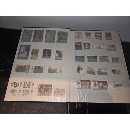 99A - 3x good albums of world stamps - small page example shown