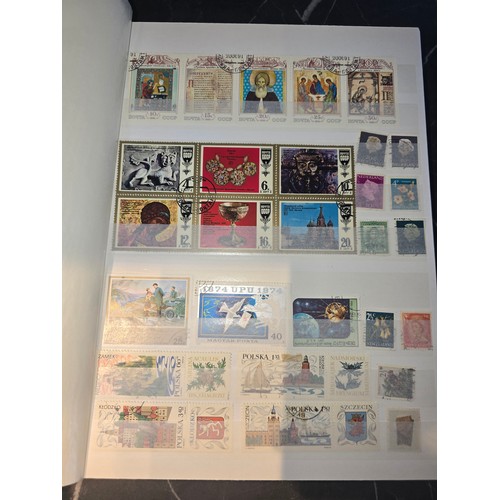 99A - 3x good albums of world stamps - small page example shown