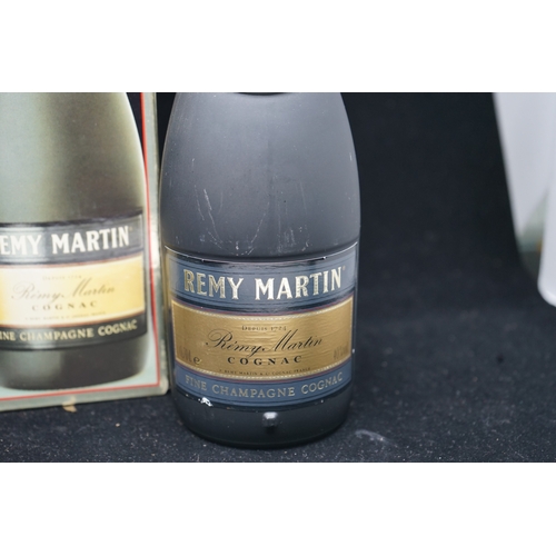 23 - 2 Bottles of Remy Martin.  One boxed.  One unboxed